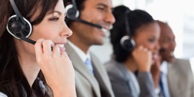 customer support personnel with headsets on